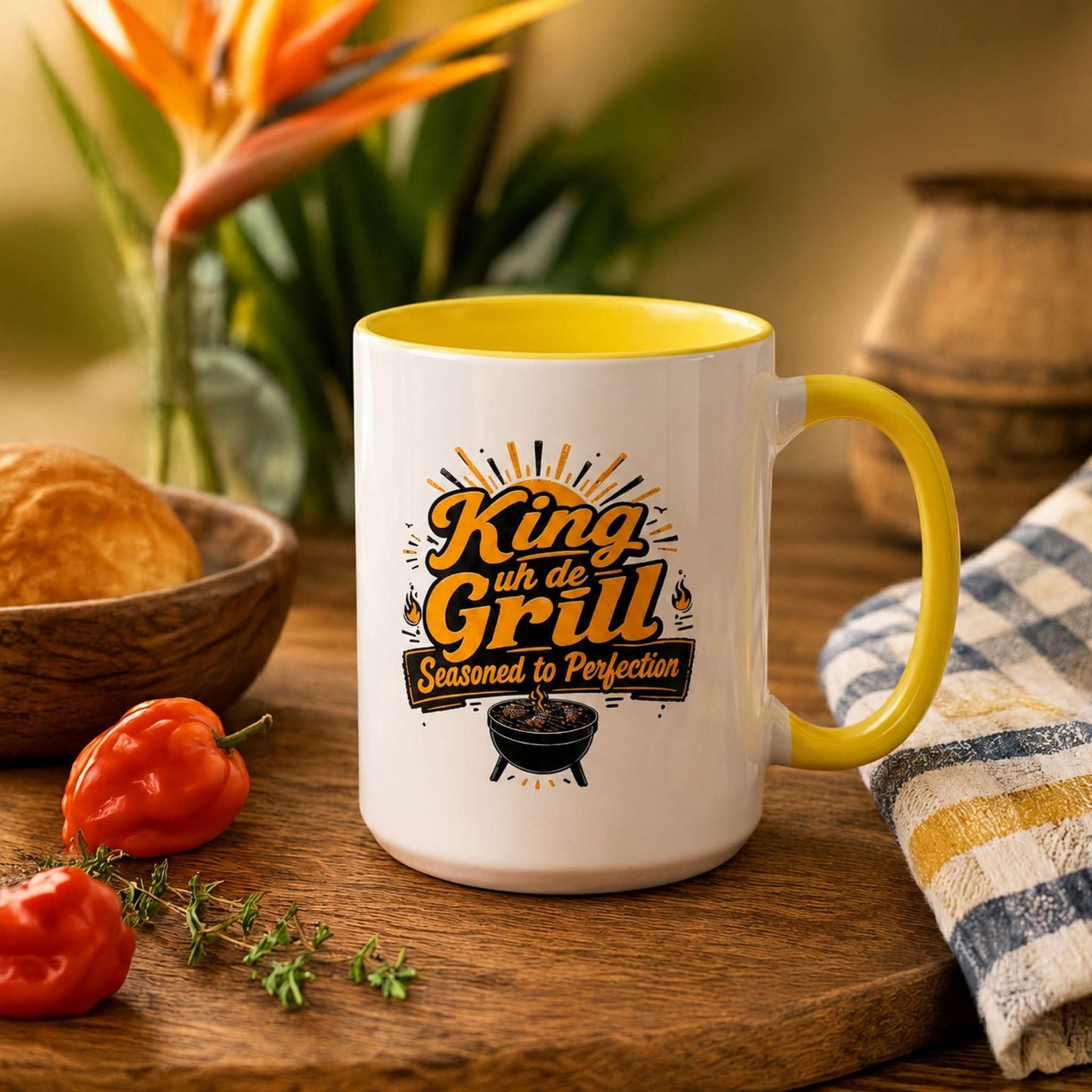 King uh de Grill accent mug with yellow handle and interior featuring Caribbean BBQ grill master design.