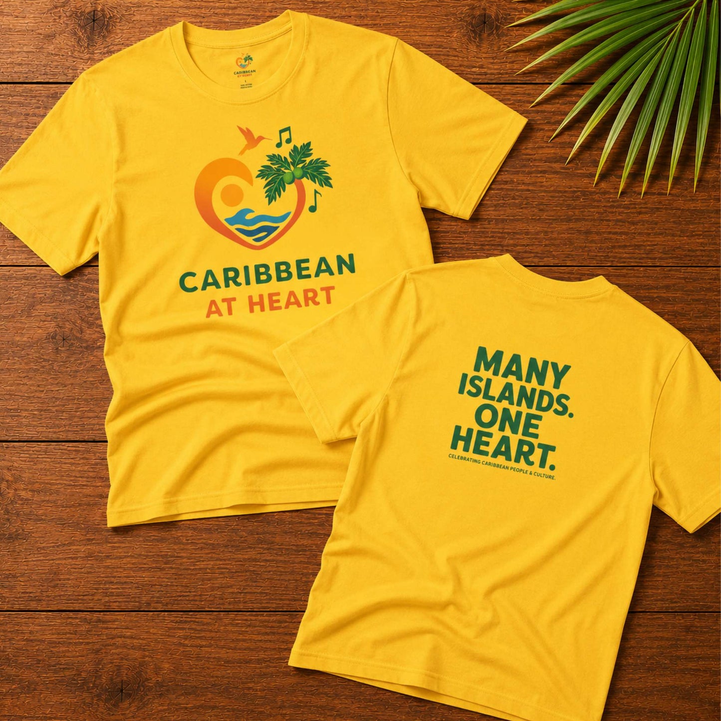Youth unisex Caribbean graphic t-shirt featuring the Caribbean At Heart logo on the front and Many Islands One Heart artwork on the back.