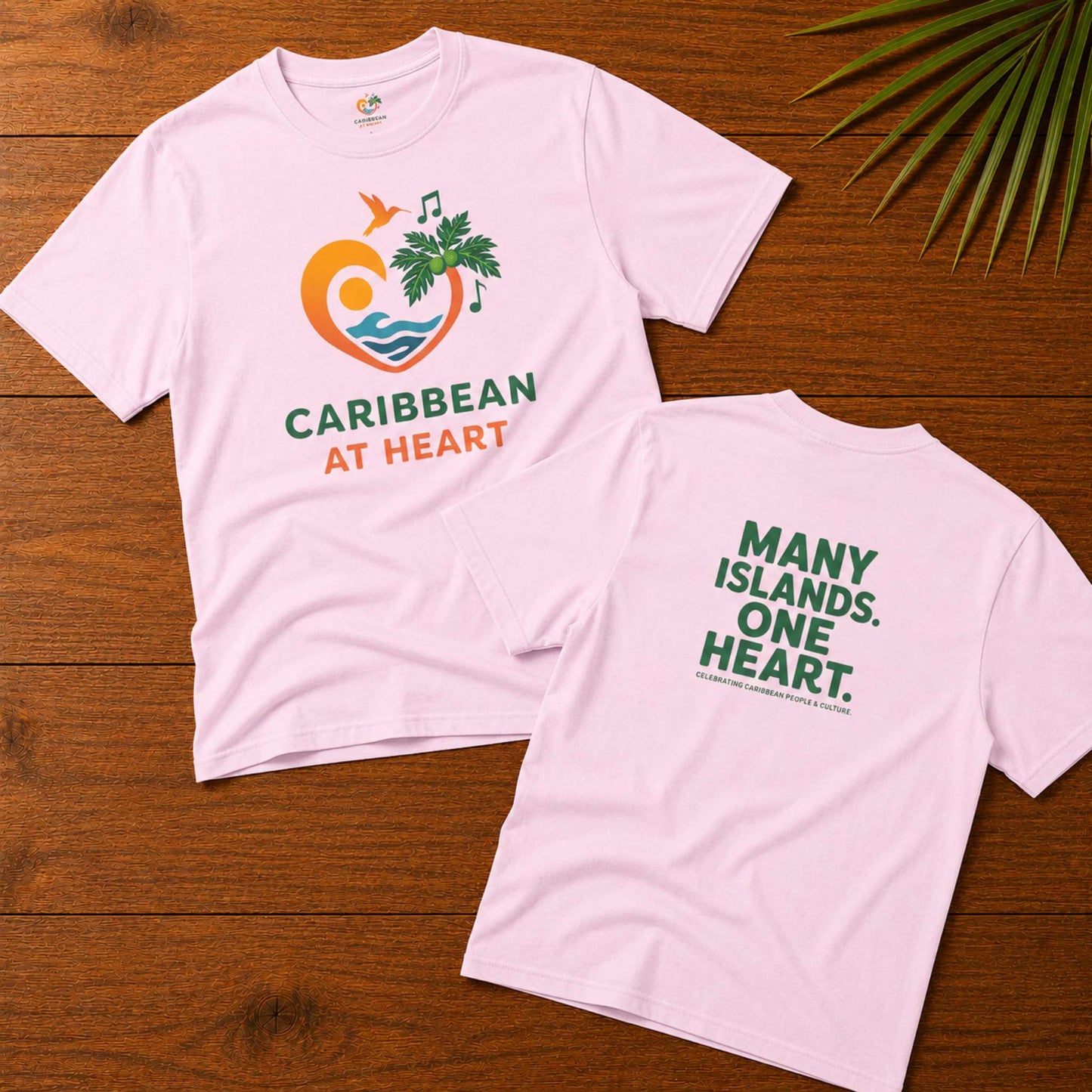 Youth unisex Caribbean graphic t-shirt featuring the Caribbean At Heart logo on the front and Many Islands One Heart artwork on the back.