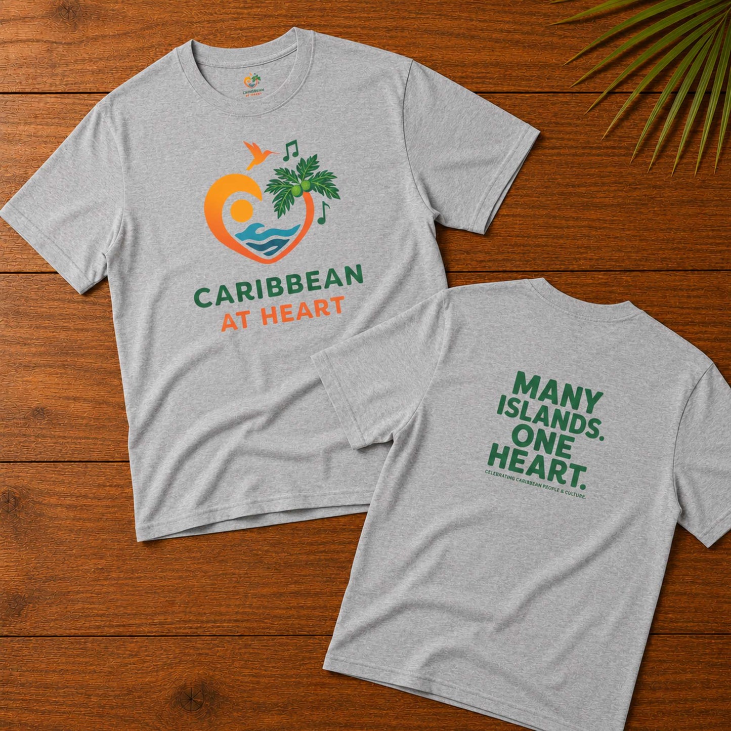 Youth unisex Caribbean graphic t-shirt featuring the Caribbean At Heart logo on the front and Many Islands One Heart artwork on the back.