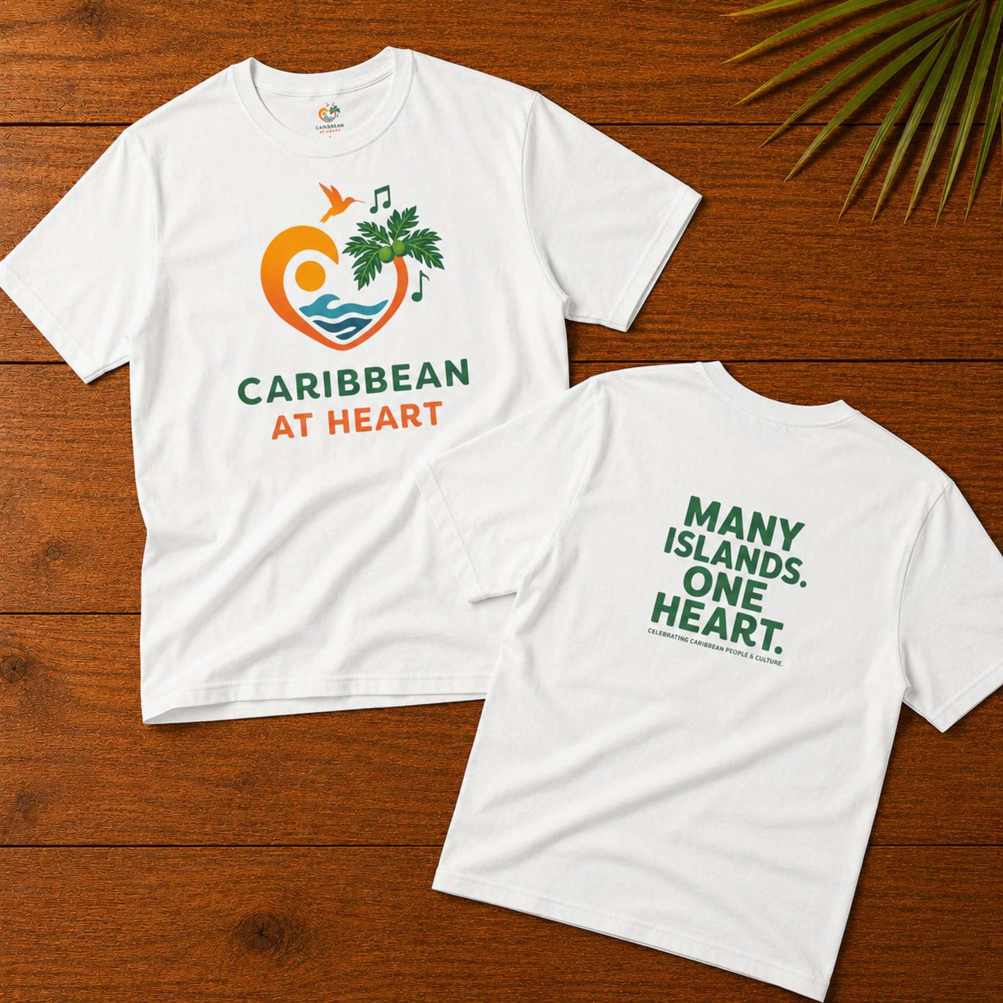 Youth unisex Caribbean graphic t-shirt featuring the Caribbean At Heart logo on the front and Many Islands One Heart artwork on the back.