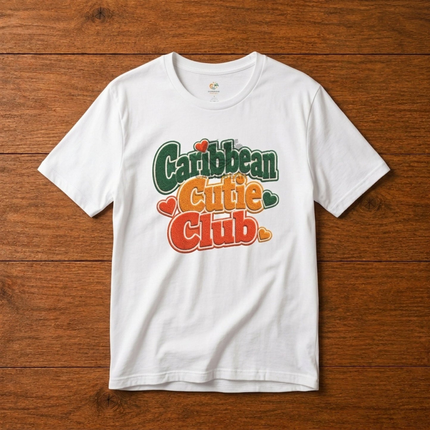 Youth shirt with Caribbean Cutie Club graphic in colorful retro lettering and heart accents.