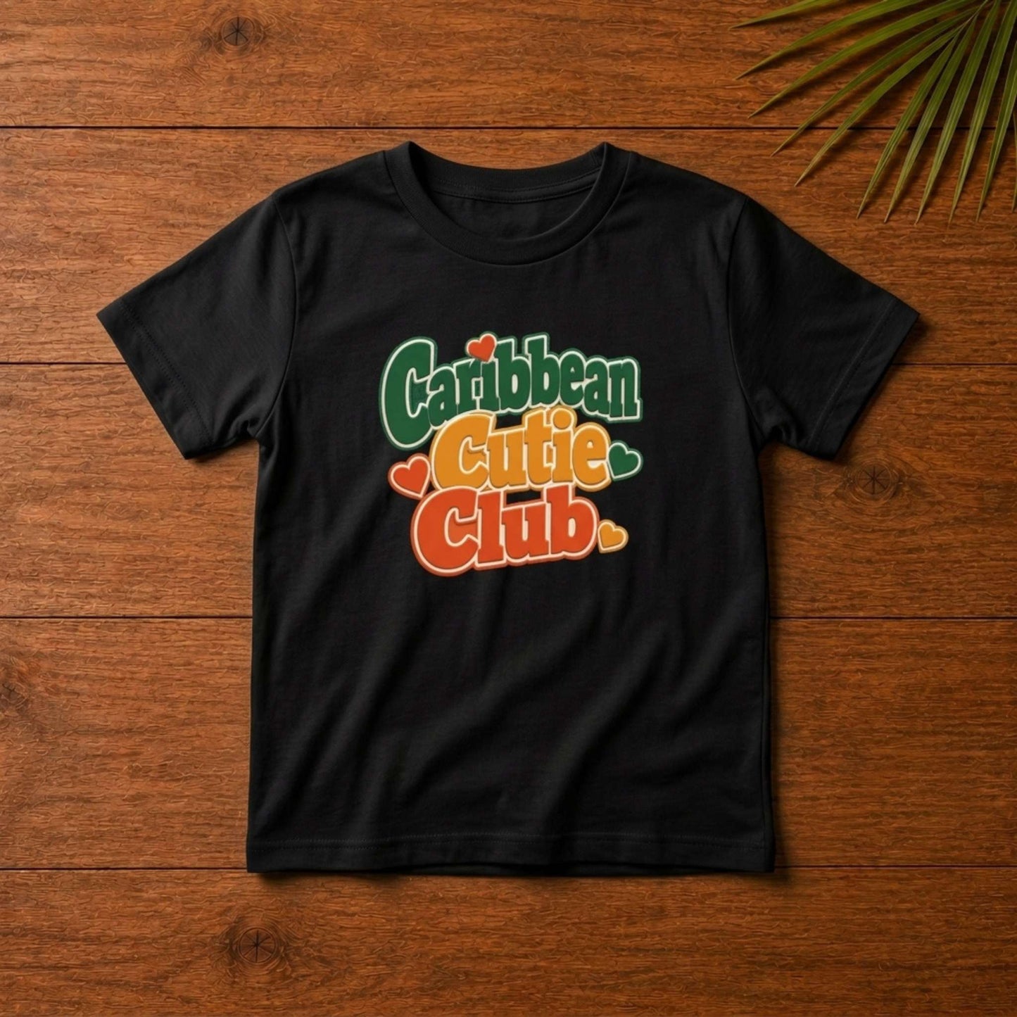 Toddler shirt with playful Caribbean Cutie Club design and heart details for matching family outfits.