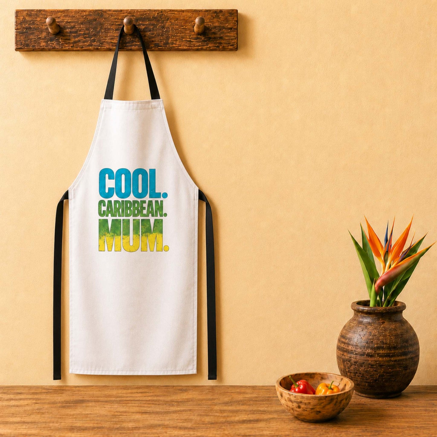 Cool Caribbean Mum apron with bold blue, green and yellow island-inspired lettering.