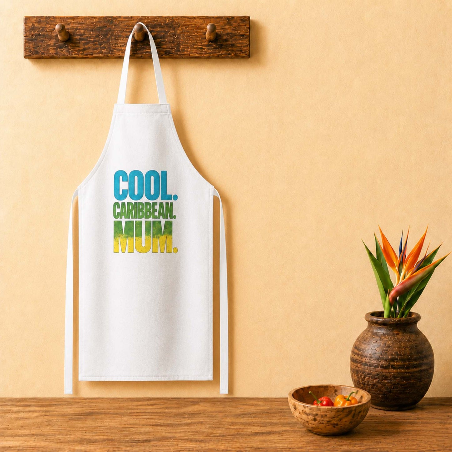 Cool Caribbean Mum apron with bold blue, green and yellow island-inspired lettering.