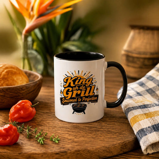 King uh de Grill accent mug with black handle and interior featuring Caribbean BBQ grill master design.