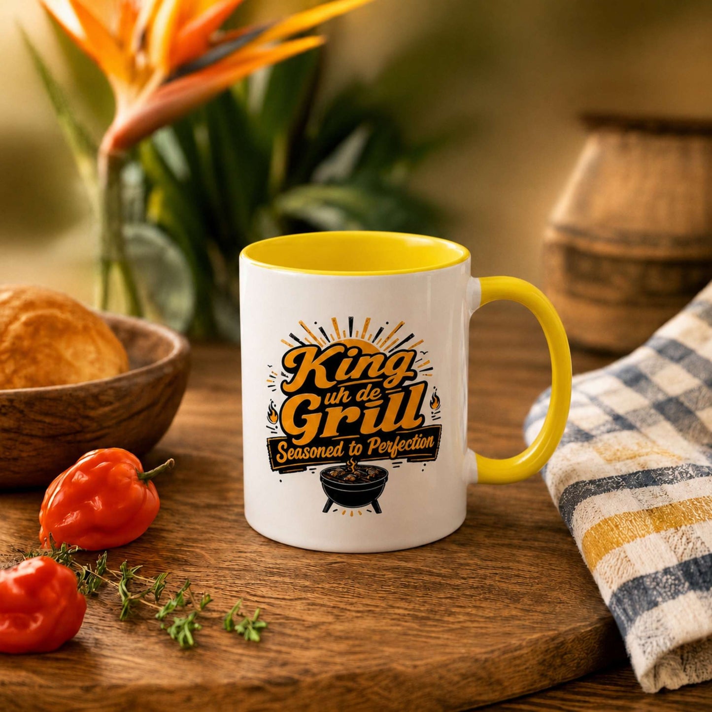 King uh de Grill accent mug with yellow handle and interior featuring Caribbean BBQ grill master design.