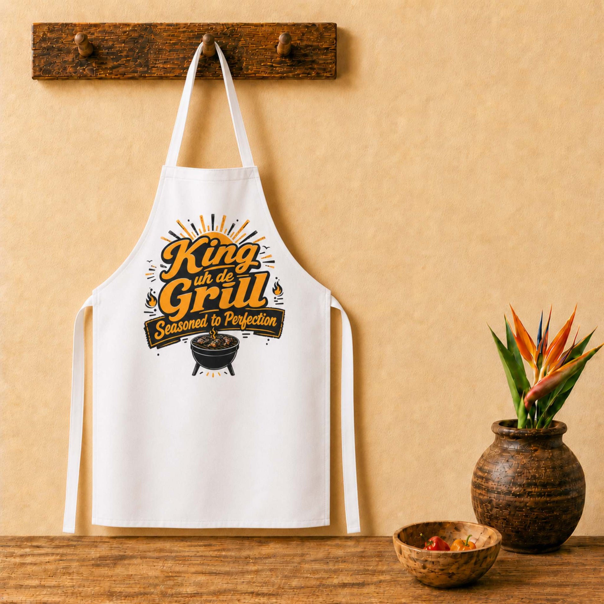King uh de Grill Caribbean apron with bold BBQ grill master graphic