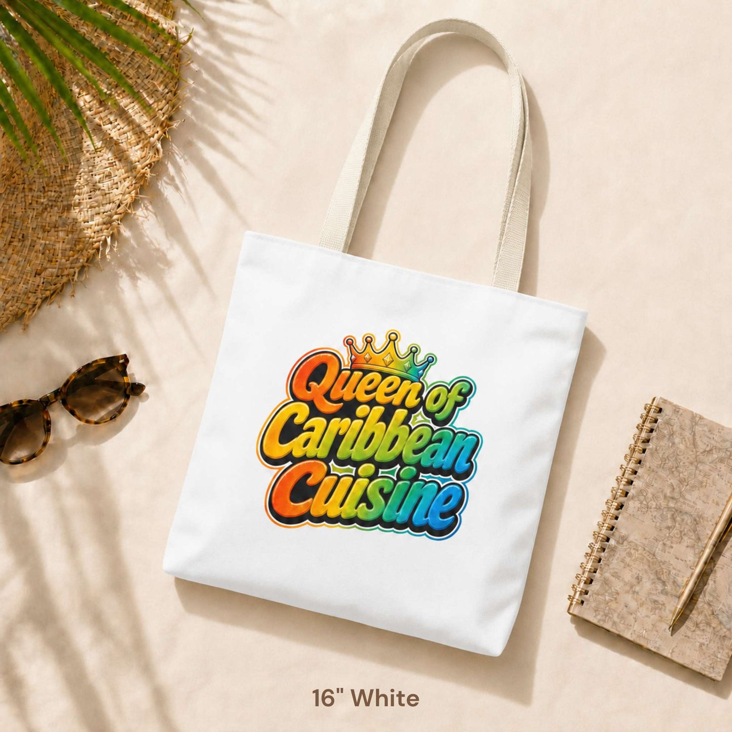 Queen of Caribbean Cuisine tote bag with colorful crown graphic and white shoulder handles, available in three sizes.