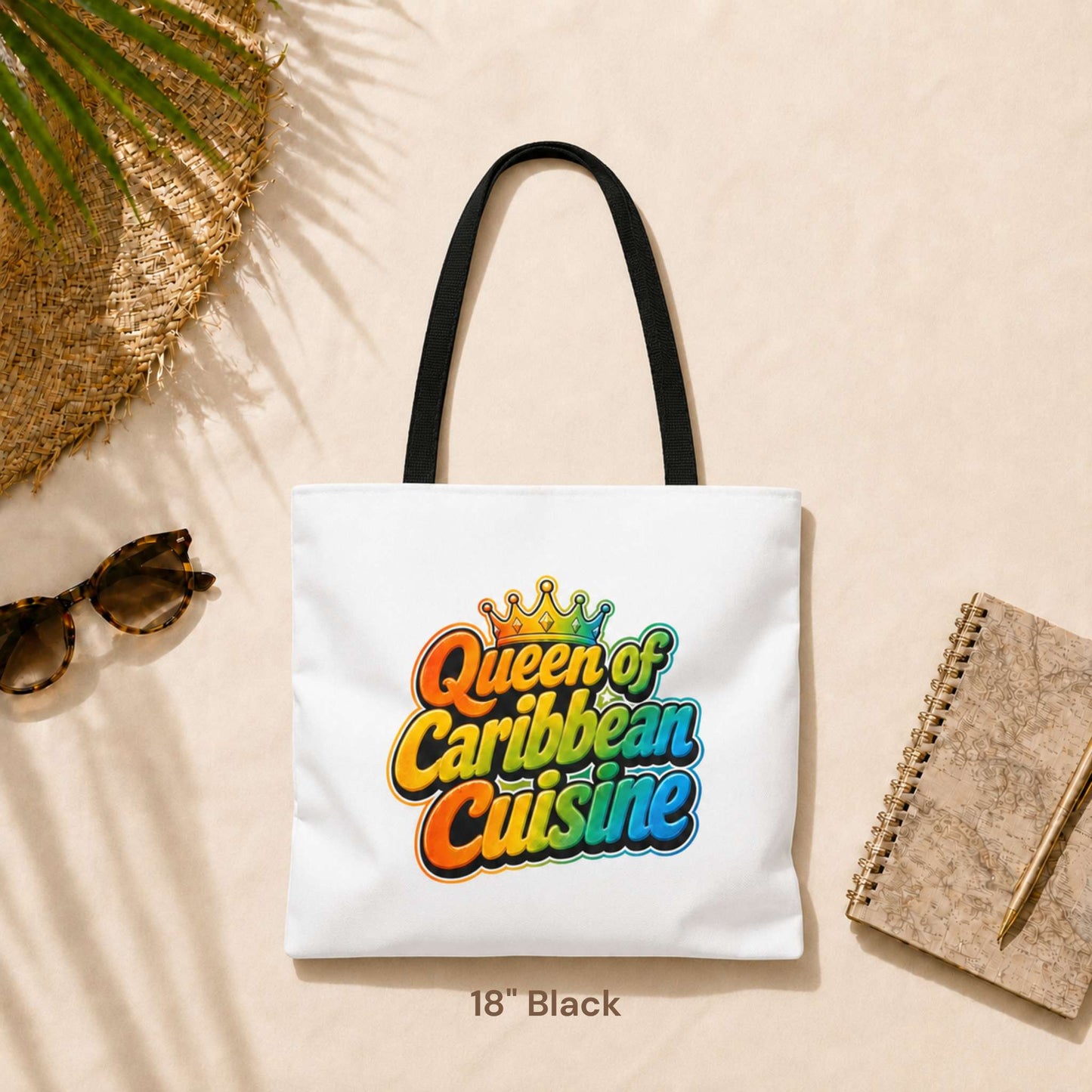Queen of Caribbean Cuisine tote bag with colorful crown graphic and black shoulder handles, available in three sizes.
