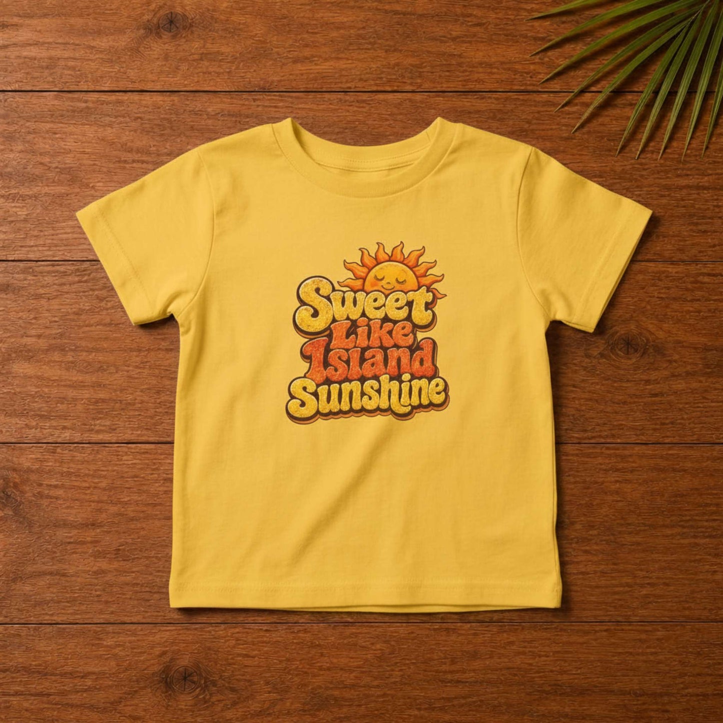 Toddler shirt with Sweet Like Island Sunshine Caribbean graphic in warm orange and yellow lettering.