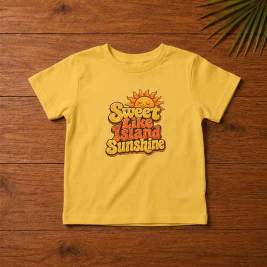 Toddler shirt with Sweet Like Island Sunshine Caribbean graphic in warm orange and yellow lettering.