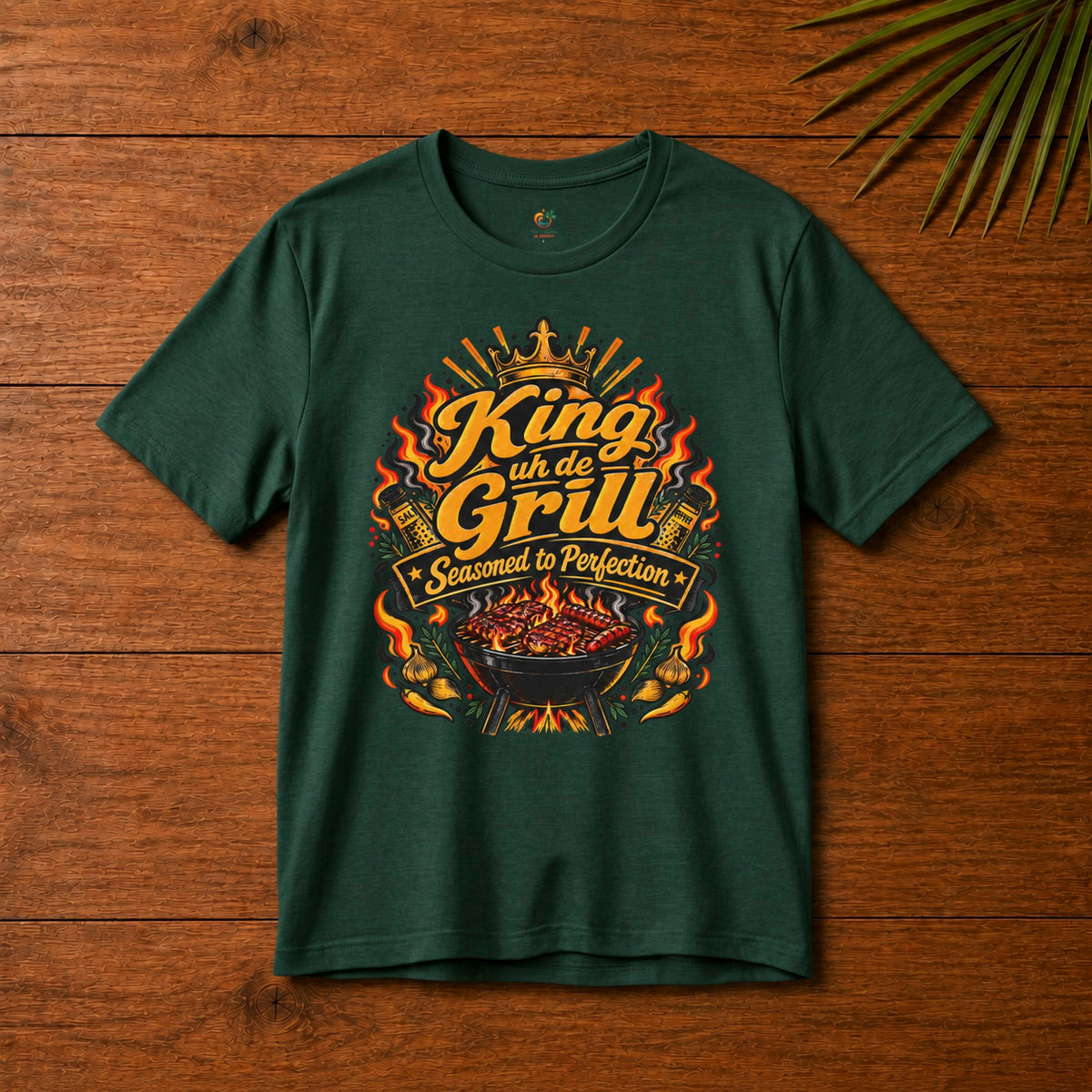 King uh de Grill Adult T-Shirt in forest green with Seasoned to Perfection grill graphic.