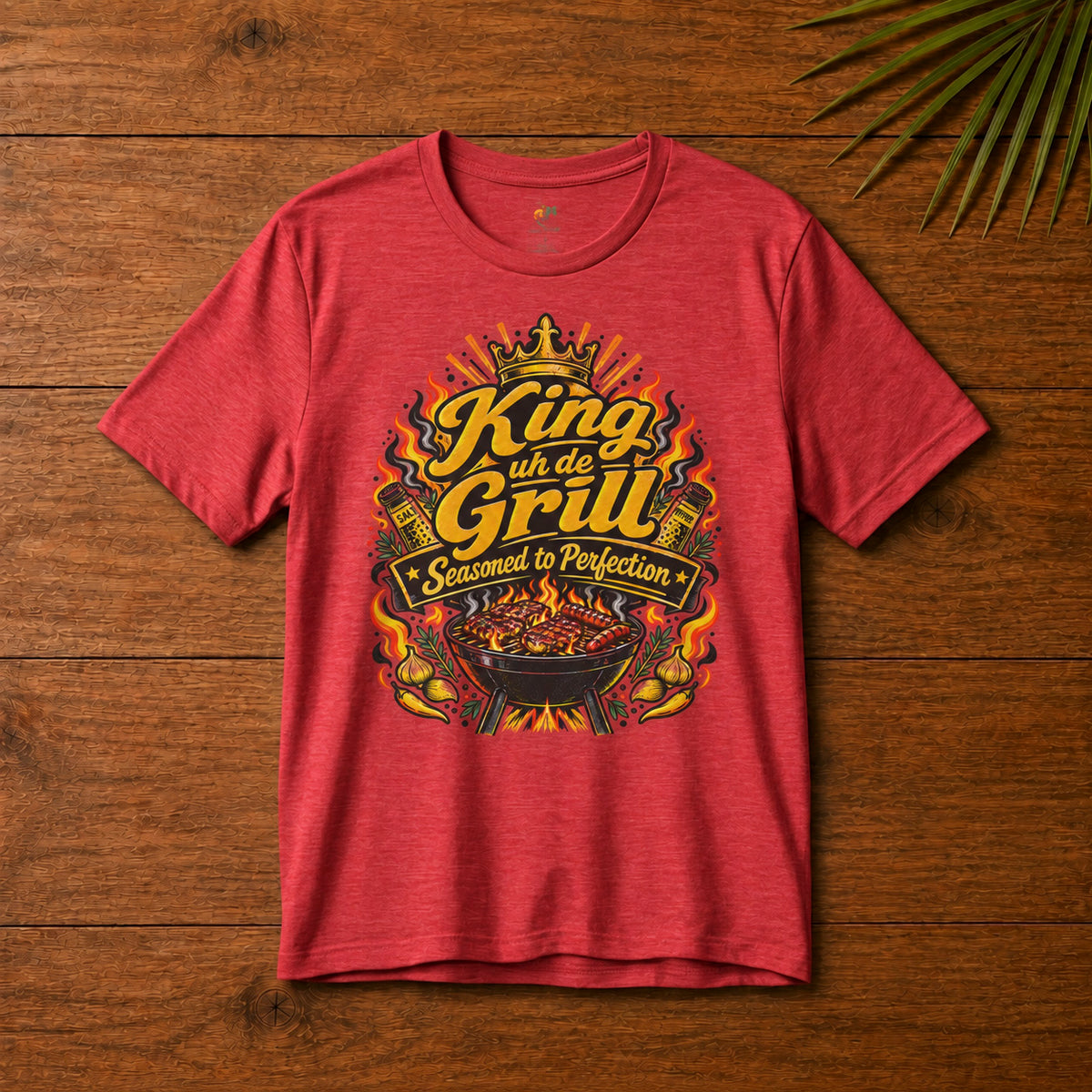 King uh de Grill Adult T-Shirt in heather red with Seasoned to Perfection grill graphic.